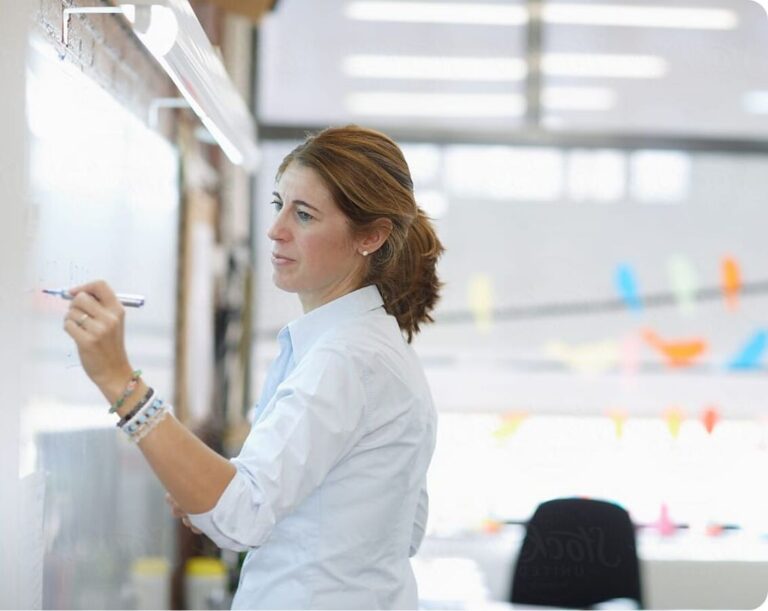 Stock photo of a teacher at the whiteboard