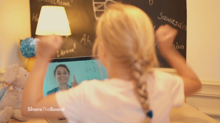 A girl repeating gestures in front of a laptop
